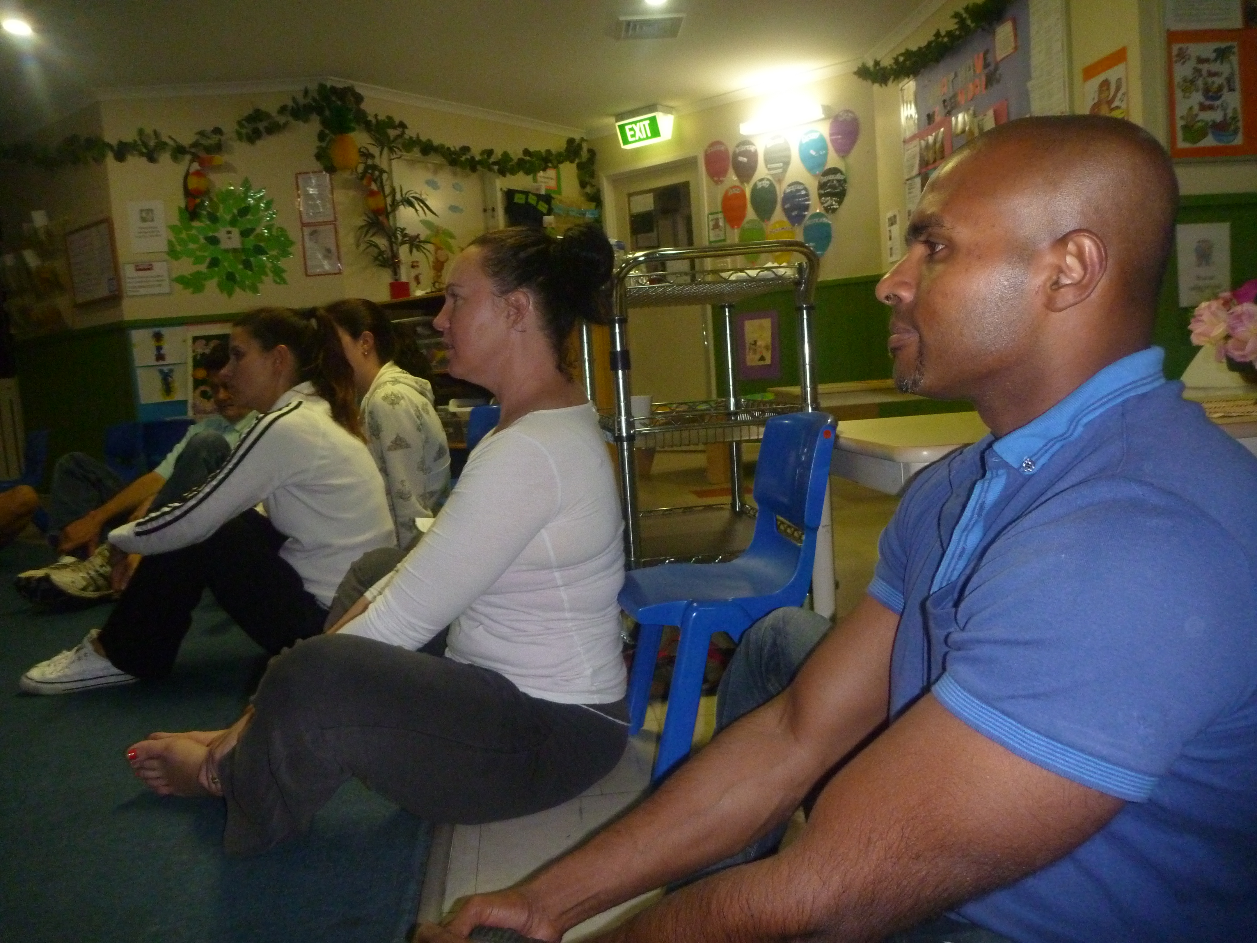 Relaxing and meditating with other parents at Bonkers Beat Music Kinder and Childcare Aspendale